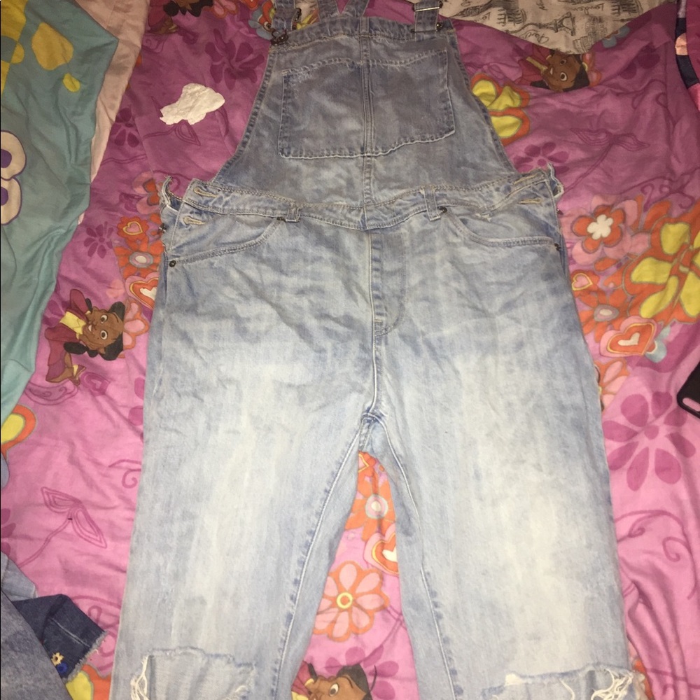 Jean jump suit distressed on knees